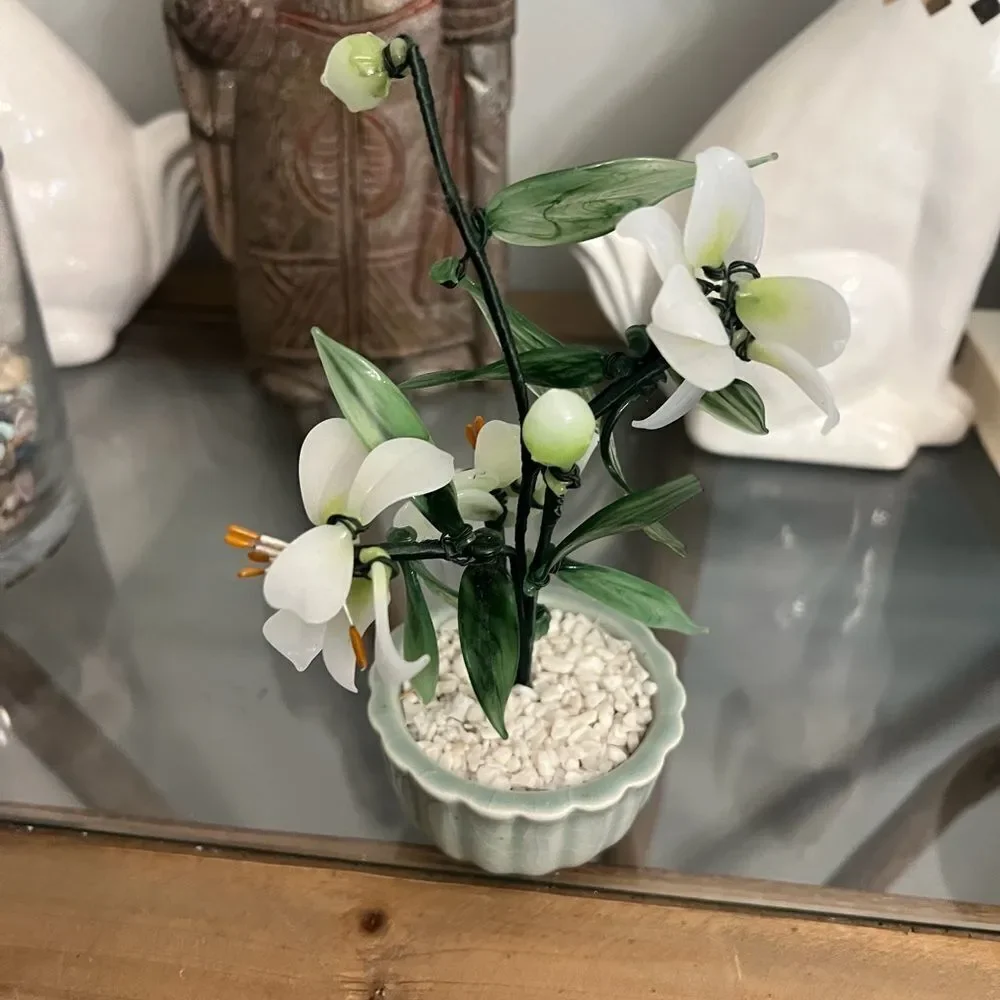 Vintage jade quartz tree in celadon pot. White and Green Plant.